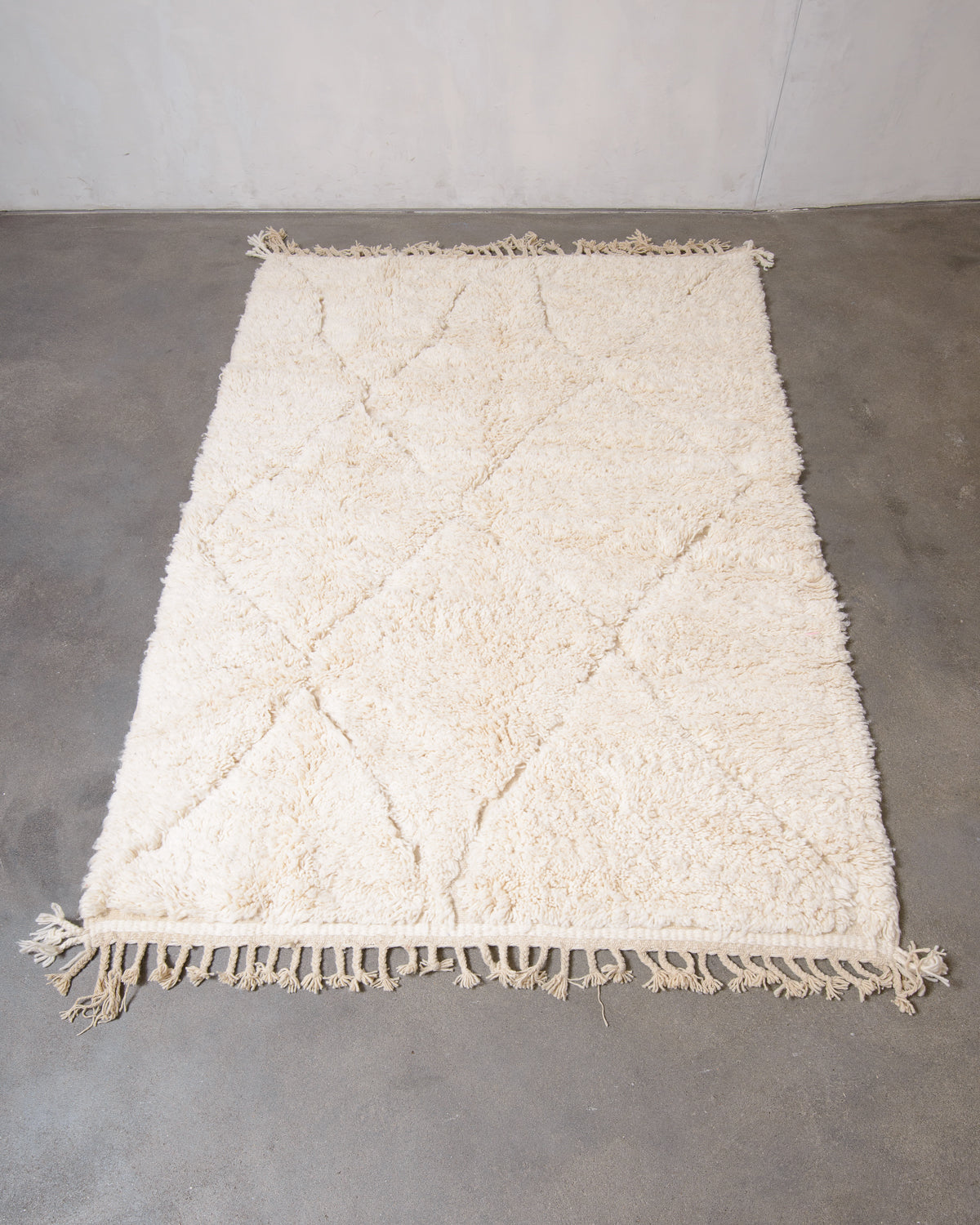 Modern, designer, handcrafted Berber rug from Morocco. Beniourain carpet with minimalist design, natural wool pile and a fluffy texture.
